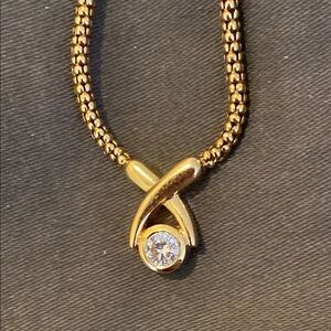 Gold Crossover Diamond Pendant Necklace with Intricate Chain